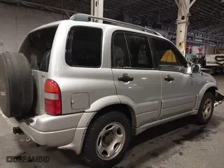 2002 Suzuki Grand Vitara JLX with VIN JS3TD62V324161291, listed as a IAAI auction lot 41577344 with 164,658 mi miles. Bid and sale history available at carsss.com. Image 4.