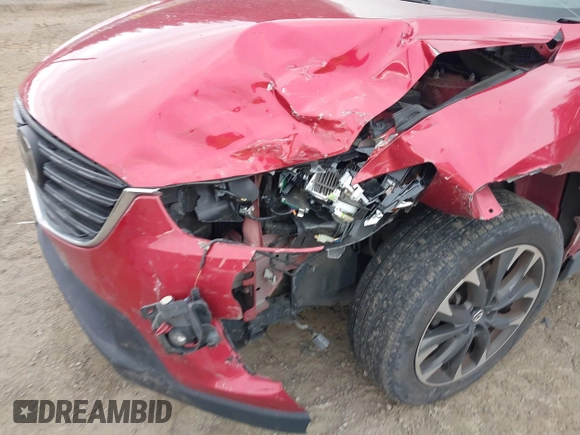 2016 Mazda CX-5 Grand Touring z VIN JM3KE4DY7G0687318, wystawiony jako IAAI lot #42228585 z przebiegiem 188 793 mil mil oraz . Historia ofert i sprzedaży dostępna na DreamBid. Obrazek 6.