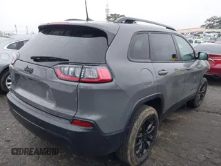2023 Jeep Cherokee Altitude Lux with VIN 1C4PJMMB8PD114958, listed as a IAAI auction lot 41862302 with 64,341 mi miles. Bid and sale history available at carsss.com. Image 4.