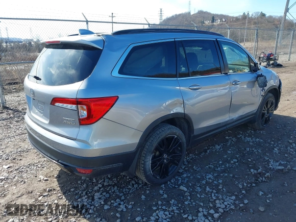 2021 Honda Pilot Special Edition with VIN 5FNYF6H20MB066095, listed as a IAAI auction lot 41863123 with 65,930 mi miles. Bid and sale history available at carsss.com. Image 4.