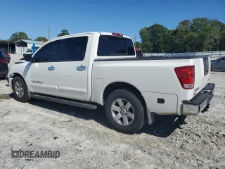 2006 Nissan Titan XE with VIN 1N6BA07A46N519520, listed as a Copart auction lot 57784305 with 164,328 mi miles and Salvage title. Bid and sale history available at DreamBid. Image 2.