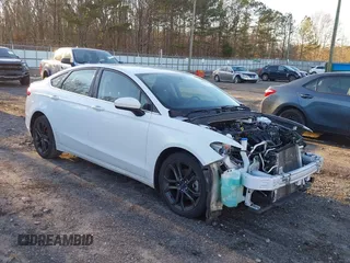 2018 Ford Fusion SE z VIN 3FA6P0H77JR108212, wystawiony jako IAAI lot #41208435 z przebiegiem 68 825 mil mil oraz . Historia ofert i sprzedaży dostępna na DreamBid. Obrazek 1.