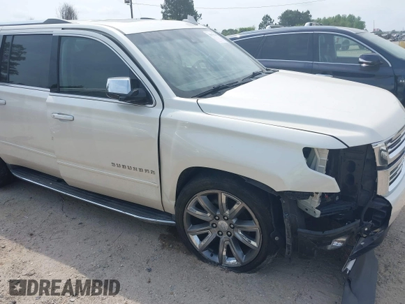 2015 Chevrolet Suburban LTZ with VIN 1GNSCKKC5FR740352, listed as a IAAI auction lot 39075234 with 112,945 mi miles and . Bid and sale history available at DreamBid. Image 6.