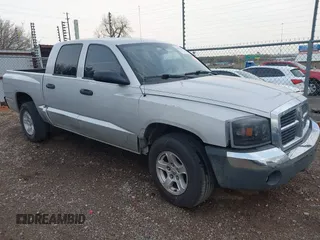 2005 Dodge Dakota SLT with VIN 1D7HE48K25S232893, listed as a IAAI auction lot 41932773 with 209,459 mi miles and . Bid and sale history available at DreamBid. Image 1.