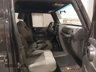 2008 Jeep Wrangler Unlimited X with VIN 1J4GA391X8L558984, listed as a IAAI auction lot 41016498 with 123,308 mi miles. Bid and sale history available at carsss.com. Image 5.