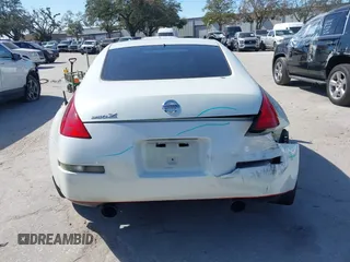 2004 Nissan 350Z Touring with VIN JN1AZ34E74T064156, listed as a IAAI auction lot 41498213 with 148,370 mi miles. Bid and sale history available at carsss.com. Image 16.