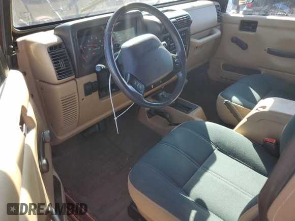 2002 Jeep Wrangler Sahara with VIN 1J4FA59S92P708647, listed as a Copart auction lot 74851654 with 131,794 mi miles and Salvage Title. Bid and sale history available at carsss.com. Image 8.
