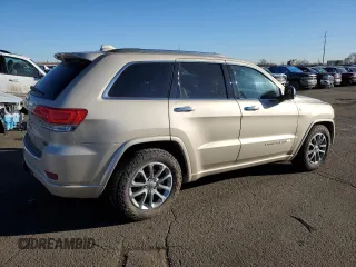 2015 Jeep Grand Cherokee High Altitude with VIN 1C4RJFCM6FC878769, listed as a Copart auction lot 46704755 with 81,727 mi miles and Salvage title. Bid and sale history available at DreamBid. Image 3.