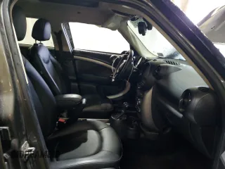 2014 MINI Countryman with VIN WMWZB3C59EWR42124, listed as a Copart auction lot 57830395 with 125,000 mi miles and Salvage title. Bid and sale history available at DreamBid. Image 7.