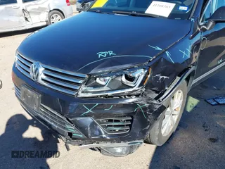 2016 Volkswagen Touareg Sport with VIN WVGEF9BP4GD012265, listed as a IAAI auction lot 41208383 with 69,205 mi miles and . Bid and sale history available at DreamBid. Image 6.