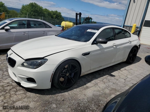 2015 BMW M6 with VIN WBS6C9C52FD467752, listed as a Copart auction lot 67884554 with 60729 miles and Salvage Title. Bid and sale history available at carsss.com. Image 1.
