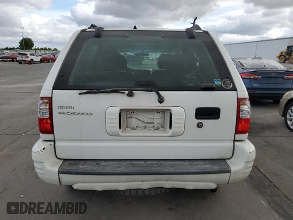 2004 Isuzu Rodeo S z VIN 4S2CK58W644300660, wystawiony jako Copart lot #54633785 z przebiegiem 375 845 mil mil oraz Szkoda całkowita • Salvage title. Historia ofert i sprzedaży dostępna na DreamBid. Obrazek 6.