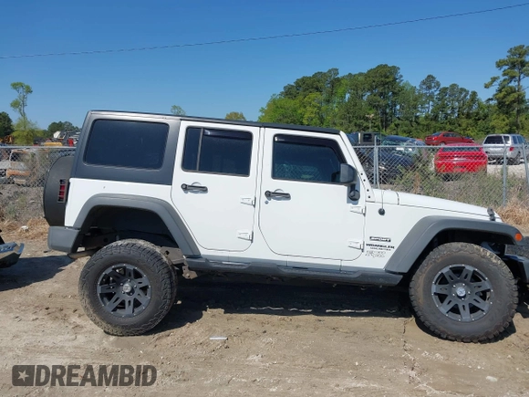 2015 Jeep Wrangler Unlimited Willys Wheeler with VIN 1C4BJWDG0FL546000, listed as a IAAI auction lot 41984566 with 112,742 mi miles and . Bid and sale history available at DreamBid. Image 13.