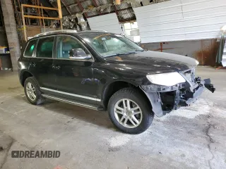 2010 Volkswagen Touareg VR6 with VIN WVGBF7A99AD002591, listed as a Copart auction lot 70624234 with 154,330 mi miles and Salvage Title. Bid and sale history available at DreamBid. Image 4.