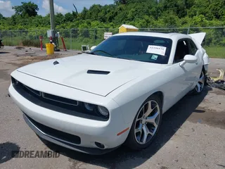2015 Dodge Challenger SXT Plus with VIN 2C3CDZBG4FH905009, listed as a IAAI auction lot 42396473 with 197,459 mi miles and . Bid and sale history available at DreamBid. Image 2.