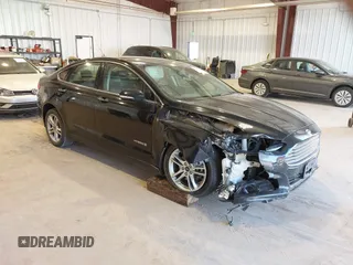 2016 Ford Fusion Titanium Hybrid with VIN 3FA6P0RU7GR127307, listed as a IAAI auction lot 41944427 with 128,076 mi miles. Bid and sale history available at carsss.com. Image 1.