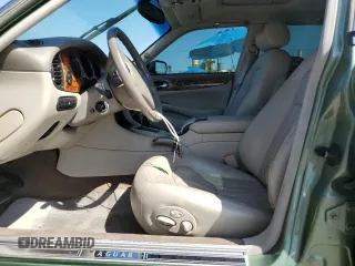 1999 Jaguar XJ with VIN SAJHX604XXC854217, listed as a Copart auction lot 56042735 with 127,092 mi miles and Salvage title. Bid and sale history available at DreamBid. Image 7.