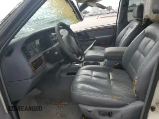 1997 Jeep Grand Cherokee Limited with VIN 1J4GX78YXVC716353, listed as a Copart auction lot 85207974 with 115,527 mi miles and Salvage Title. Bid and sale history available at carsss.com. Image 7.