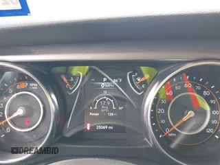 2023 Jeep Wrangler Sport with VIN 1C4HJXDG2PW508235, listed as a IAAI auction lot 42127823 with 25,069 mi miles and . Bid and sale history available at DreamBid. Image 7.