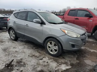 2010 Hyundai Tucson GLS with VIN KM8JU3AC2AU113747, listed as a Copart auction lot 48031375 with 220,982 mi miles and Salvage Title. Bid and sale history available at DreamBid. Image 4.