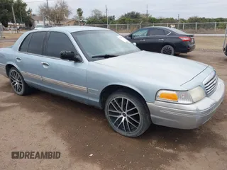 2002 Ford Crown Victoria LX z VIN 2FAFP74W12X119070, wystawiony jako IAAI lot #41362402 z przebiegiem 163 360 mil mil oraz . Historia ofert i sprzedaży dostępna na DreamBid. Obrazek 1.