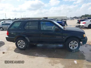 2001 Isuzu Rodeo S with VIN 4S2CK58W114363340, listed as a IAAI auction lot 41498698 with 185,408 mi miles and . Bid and sale history available at DreamBid. Image 13.