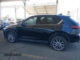 2020 Mazda CX-5 Grand Touring z VIN JM3KFADMXL0740144, wystawiony jako IAAI lot #41830203 z przebiegiem 70 535 mil mil oraz . Historia ofert i sprzedaży dostępna na DreamBid. Obrazek 14.