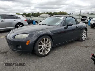 2007 Mazda MX-5 Miata Sport z VIN JM1NC25F570125639, wystawiony jako Copart lot #69319034 z przebiegiem 89 275 mil mil oraz Szkoda całkowita • Salvage title. Historia ofert i sprzedaży dostępna na DreamBid. Obrazek 1.