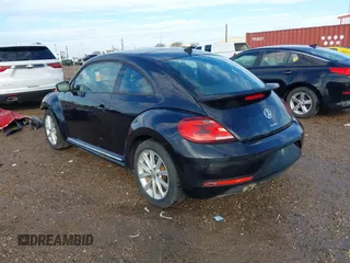 2018 Volkswagen Beetle S with VIN 3VWFD7ATXJM706338, listed as a IAAI auction lot 41293181 with 71,945 mi miles. Bid and sale history available at carsss.com. Image 3.