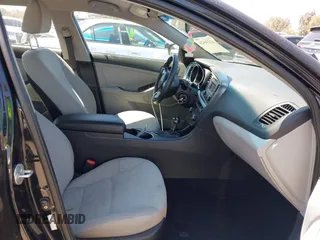2015 Kia Optima LX with VIN KNAGM4A7XF5615069, listed as a IAAI auction lot 42234624 with 174,078 mi miles and . Bid and sale history available at DreamBid. Image 5.