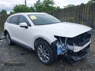 2019 Mazda CX-9 Signature z VIN JM3TCBEY6K0307102, wystawiony jako IAAI lot #42645716 z przebiegiem 55 299 mil mil oraz . Historia ofert i sprzedaży dostępna na DreamBid. Obrazek 1.