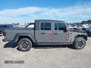 2021 Jeep Gladiator Willys with VIN 1C6HJTAG4ML517715, listed as a IAAI auction lot 41436634 with 21,187 mi miles and . Bid and sale history available at DreamBid. Image 13.
