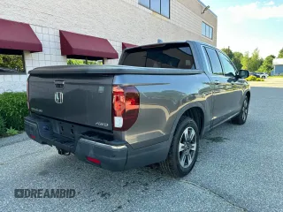 2019 Honda Ridgeline RTL-E with VIN 5FPYK3F71KB009532, listed as a Copart auction lot 65827935 with 217,177 mi miles and Clean title. Bid and sale history available at DreamBid. Image 4.