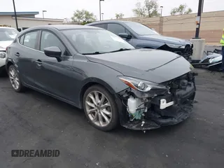 2014 Mazda 3 s Touring with VIN JM1BM1L35E1208952, listed as a IAAI auction lot 42121077 with 183,985 mi miles. Bid and sale history available at carsss.com. Image 1.