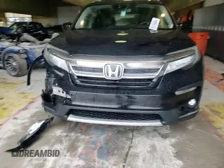 2020 Honda Pilot Touring 8-Passenger with VIN 5FNYF6H90LB043055, listed as a Copart auction lot 85194544 with 82,144 mi miles and Salvage Title. Bid and sale history available at DreamBid. Image 12.