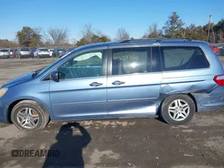 2005 Honda Odyssey EX-L with VIN 5FNRL38765B076591, listed as a IAAI auction lot 41624354 with 172,698 mi miles and . Bid and sale history available at DreamBid. Image 13.