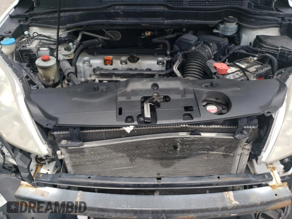 2010 Honda CR-V LX with VIN 3CZRE3H35AG705585, listed as a Copart auction lot 60032855 with 115,136 mi miles and Salvage title. Bid and sale history available at DreamBid. Image 11.