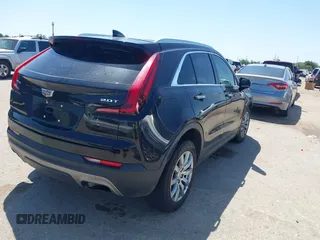 2019 Cadillac XT4 FWD Premium Luxury with VIN 1GYFZCR48KF141478, listed as a IAAI auction lot 41988092 with 53,970 mi miles and . Bid and sale history available at carsss.com. Image 4.