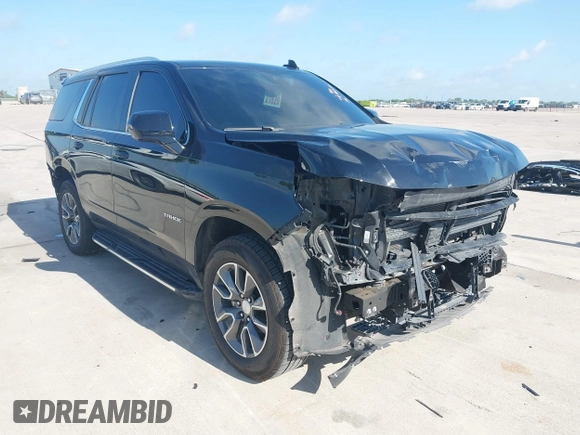 2023 Chevrolet Tahoe LT z VIN 1GNSCNKDXPR477061, wystawiony jako IAAI lot #42225743 z przebiegiem 57 077 mil mil oraz . Historia ofert i sprzedaży dostępna na DreamBid. Obrazek 1.