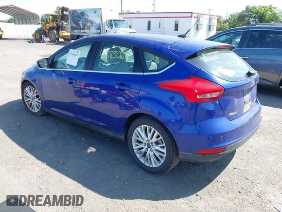 2015 Ford Focus Titanium z VIN 1FADP3N25FL291844, wystawiony jako IAAI lot #42383067 z przebiegiem 82 545 mil mil oraz . Historia ofert i sprzedaży dostępna na DreamBid. Obrazek 3.