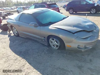 2000 Pontiac Firebird with VIN 2G2FS22K0Y2112410, listed as a IAAI auction lot 41676541 with 129,857 mi miles. Bid and sale history available at carsss.com. Image 1.