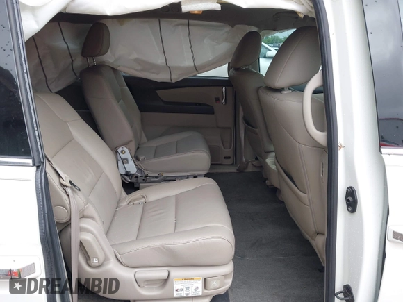 2014 Honda Odyssey Touring with VIN 5FNRL5H95EB059729, listed as a IAAI auction lot 42148110 with 135,304 mi miles and . Bid and sale history available at DreamBid. Image 8.