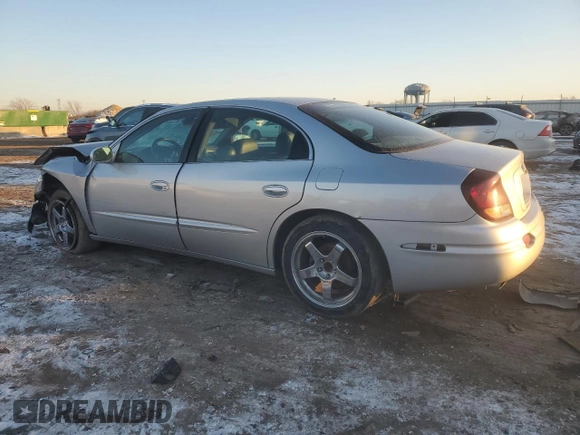 2003 Oldsmobile Aurora z VIN 1G3GS64C034150414, wystawiony jako Copart lot #88490635 z przebiegiem 119 061 mil mil oraz Szkody całkowita. Historia ofert i sprzedaży dostępna na DreamBid. Obrazek 2.