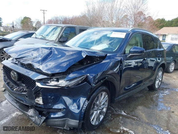 2021 Mazda CX-5 Grand Touring with VIN JM3KFADM1M1356538, listed as a IAAI auction lot 41723485 with 91,925 mi miles. Bid and sale history available at carsss.com. Image 2.