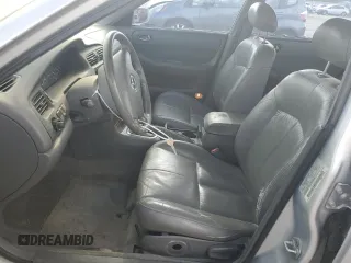 2000 Mazda 626 LX with VIN 1YVGF22C3Y5126135, listed as a Copart auction lot 70650264 with 154,517 mi miles and Salvage Title. Bid and sale history available at carsss.com. Image 7.