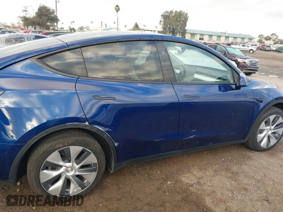 2023 Tesla Model Y Long Range with VIN 7SAYGDEE6PF947827, listed as a IAAI auction lot 41443524 with 12,381 mi miles and . Bid and sale history available at DreamBid. Image 6.