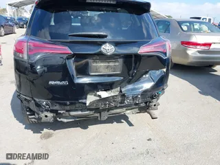 2018 Toyota RAV4 LE with VIN 2T3ZFREVXJW457751, listed as a IAAI auction lot 41529251 with 230,054 mi miles. Bid and sale history available at carsss.com. Image 6.