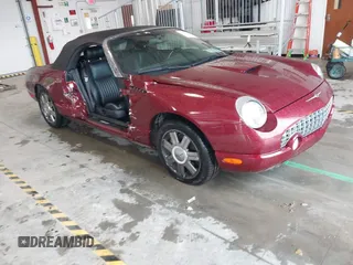 2004 Ford Thunderbird Deluxe z VIN 1FAHP60AX4Y102980, wystawiony jako IAAI lot #42234569 z przebiegiem 35 273 mil mil oraz . Historia ofert i sprzedaży dostępna na DreamBid. Obrazek 1.
