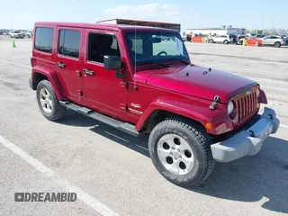 2013 Jeep Wrangler Unlimited Sahara with VIN 1C4BJWEG5DL569977, listed as a IAAI auction lot 41980394 with 145,571 mi miles and . Bid and sale history available at DreamBid. Image 1.