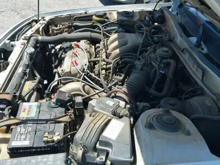 1991 Toyota Camry z VIN 4T1VV21E8MU047512, wystawiony jako IAAI lot #42854666 z przebiegiem 123 306 mil mil oraz . Historia ofert i sprzedaży dostępna na DreamBid. Obrazek 12.